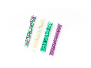 set of colorful sprinkles in sticks isolated on white