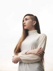 Young pierced woman in white blouse portrait