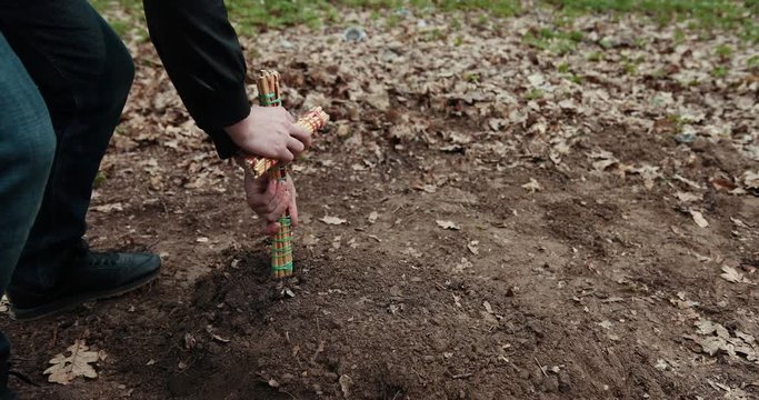The Guy Sets A Homemade Cross On The Grave Of A Dead Pet. Dog Funeral, Grave With A Cross. Close Up. Prores, Slow Motion