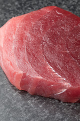Slice of fresh raw yellowfin tuna steak