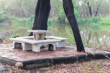 outdoor marble table set near pond at Thailand