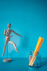 Yellow paper straws isolated on blue background