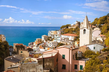 Autumn view of Riomaggiore town and Ligurian Sea at noon time.