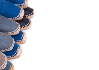  Espadrilles on a white background with copy space. Espadrilles closeup. Collection of espadrilles on a white background. Espadrilles lying on top of each other.