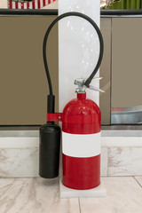 Obraz premium Fire protection equipment, Fire extinguisher on white stand