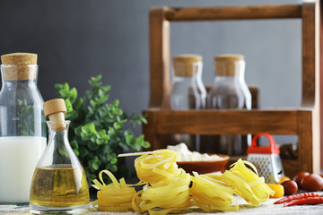 Pasta uncooked on the table. Noodles in the form of nests.