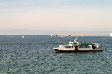 SEBASTOPOL, RUSSIA - NOVEMBER 4,2018: Artillery bay of Black sea, view of passenger boat.