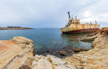 Panorama of cargo vessel "Edro III" shipwreck near rocky coast in Mediterranean sea at Paphos, Cyprus