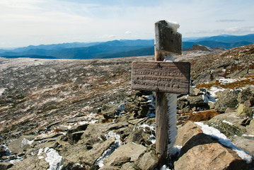 Sign for Tuckerman Ravine in early fall weather with rime ice on ridge on Mount Washington