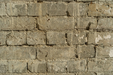 Old vintage brick wall pattern background from an abandoned building