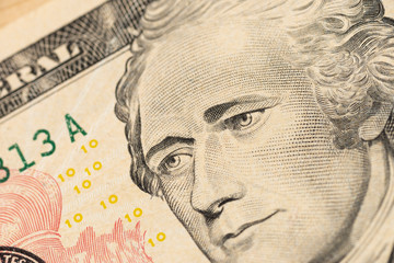 Alexander Hamilton face on US ten or 10 dollars bill macro, united states money closeup