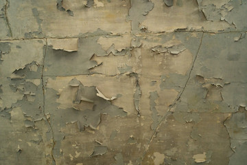 Textured going of greenish paint on a concrete wall in Amiantos abandoned hospital on Cyprus....
