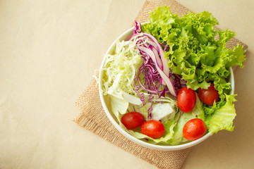 Close up bowl of vegetable salad,cherry tomatoes,red cabbage,lettuce.healthy food.