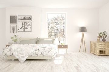 Fototapeta na wymiar Stylish bedroom in white color with winter landscape in window. Scandinavian interior design. 3D illustration