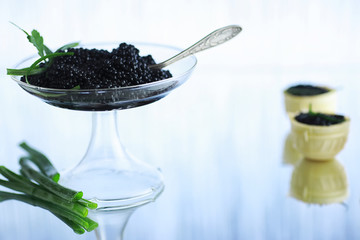 Fresh black fish roe. Beluga caviar served with ice.