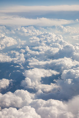 Fototapeta premium Fluffy white clouds, a view from airplane window