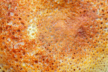 Background from the surface of a ruddy pancake close-up.