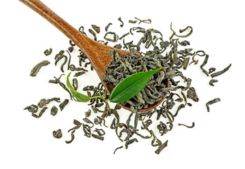 Green tea leaves and dried tea on a wooden spoon, white background.