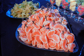 Ripe orange tangerine clove closeup.