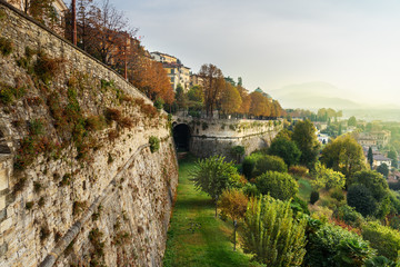 Fototapeta na wymiar View of Bergamo with Sant Andrea platform of Venetian Walls at morning. Italy