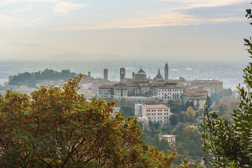 Fototapeta na wymiar View of Bergamo Old City from Saint Vigilio hill in morning. Italy
