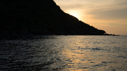 Landscape of beautiful sunset in Phu Quoc island sandy beach with colorful sky and dramatic clouds over wavy sea	