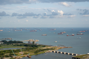 Fototapeta na wymiar Singapore anchorage area panorama opposite Gardens by the Bay with many ships on an anchorage 
