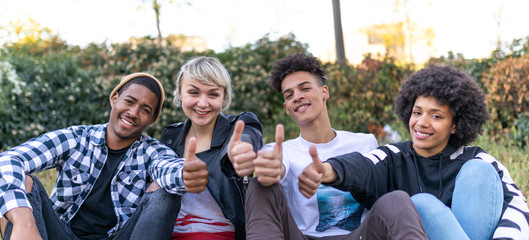 Friends from different cultures in the city smiling