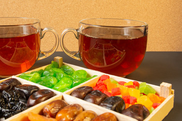 Oriental sweets, dried fruit with a cups of tea
