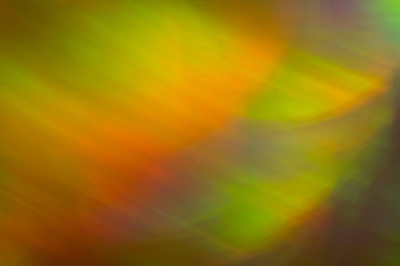 Blurry yellow light spot on dark background. Bokeh lens flare glow. Abstract design.