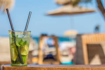 Cold tasty mojito cocktail on the beach
