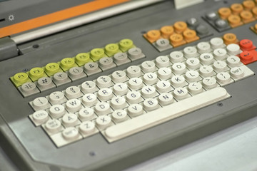 Old dirty computer keyboard with round buttons, closeup fragment