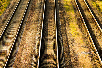 Fototapeta na wymiar Train station and railway, top view. Railway platform. Heavy industry. Conceptual background. The railway lines and rails close-up.