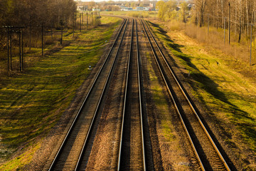 Fototapeta premium Train station and railway, top view. Railway platform. Heavy industry. Conceptual background. The railway lines and rails close-up.
