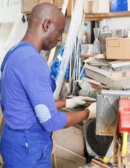 glazier working on glass edge polishing machine