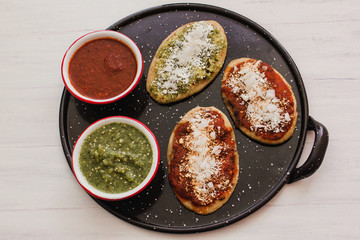 mexican tlacoyos with green and red sauce, Traditional food in Mexico