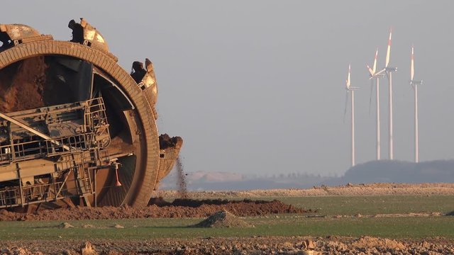 Concept of coal power against wind power