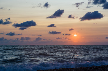 Amazing sea sunset, the sun, waves, clouds