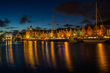 Fototapeta na wymiar Scenic view at sunset of Bergen harbour and Bryggen waterfront, famous for its historic wooden houses part of UNESO World Heritage Site, Norway