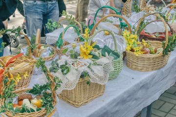 food baskets set on a table prepared to be ordained, traditional custom on a large Saturday in Poland, Slovenia, Austria and Bavaria