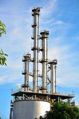 Close-up of pipelines and destillation tanks of an oil-refinery plant