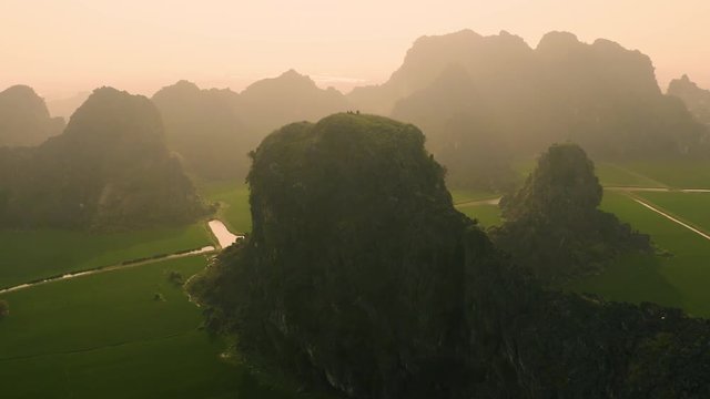 4k Aerial drone footage - Beautiful mountains, jungle, and rice fields of northern Vietnam at sunset.  Asia