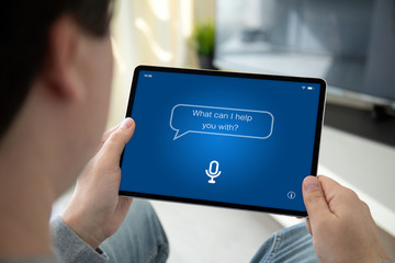 man hands holding computer tablet with app personal assistant