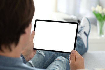 man holding in his hands computer tablet with isolated screen