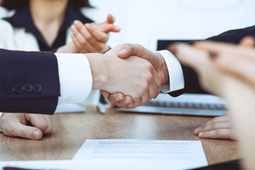 Obraz premium Business people shaking hands at meeting or negotiation in the office. Handshake concept. Partners are satisfied because signing contract