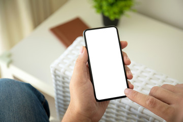 man hands holding phone with isolated screen in the room
