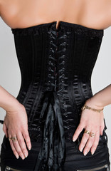 Woman  laced in a corset.