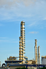 Close-up of pipelines and destillation tanks of an oil-refinery plant