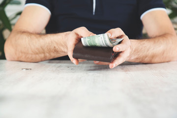 man hand money with wallet