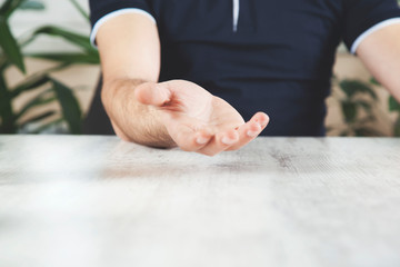 man empty palm on desk
